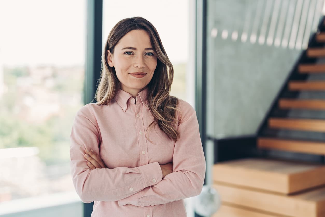 Professional woman smiling in office environment