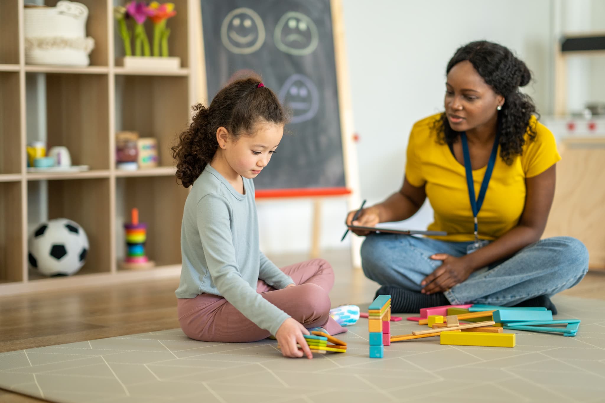 Child learning with therapist