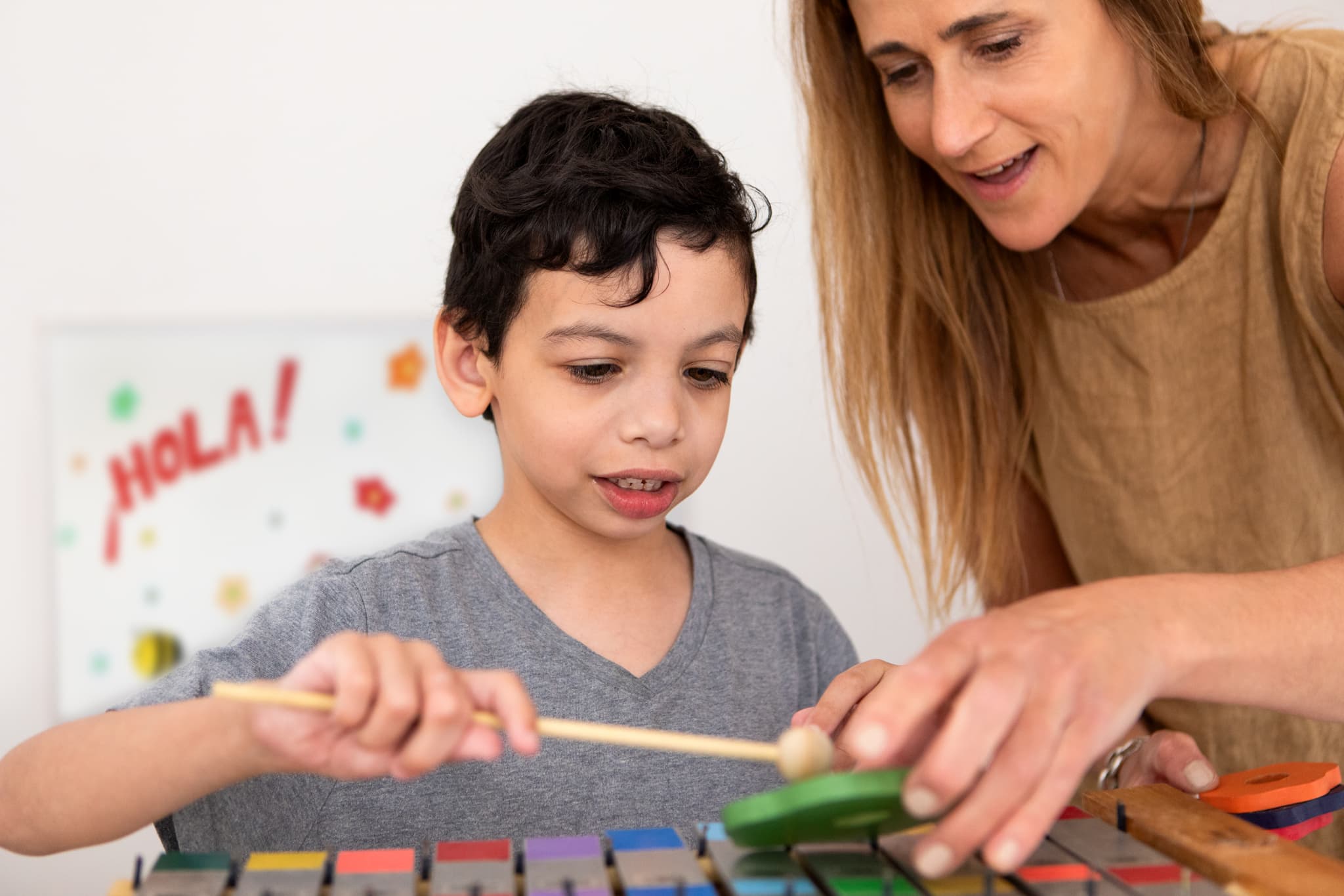 Therapist working with a child on learning activities